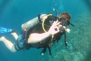 Stuart Low, Biza founder and CEO, diving in Fiji, giving us the ok symbol.